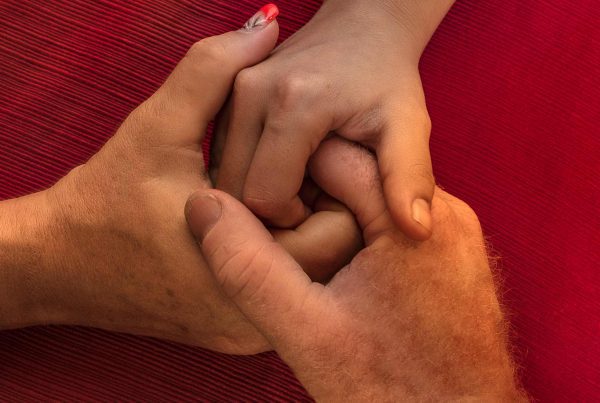 3 hands holding