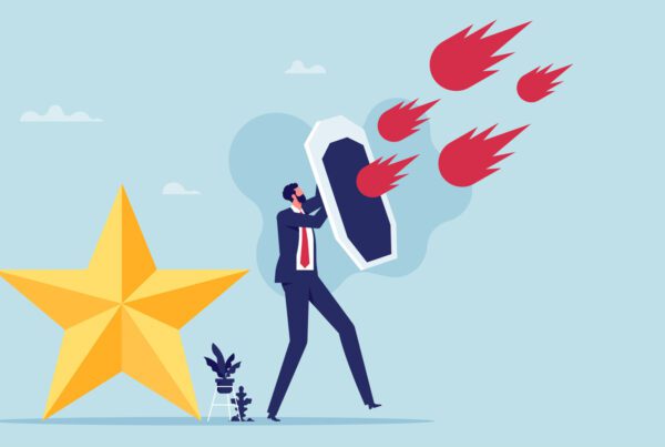 Illustration of business man holidng a shield against meteors